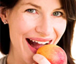 Lady biting an apple. 